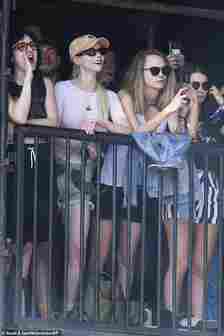 Anya sang her heart out as she watched a performance alongside Cara, who was glued to her phone recording the act