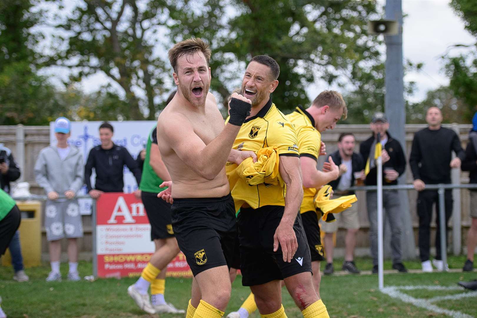 Tadley centre-back Brad Passfield celebrates the winner against Dartford with Nathan Smart. Photo by Rob Mellor