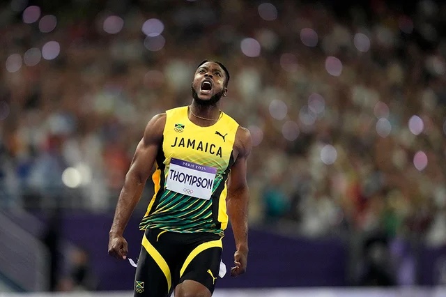 Kishane Thompson reacts after crossing the finish line during mens 100 meters final
