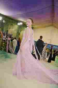 Image may contain Brianne Howey Clothing Dress Formal Wear Fashion Gown Wedding Wedding Gown Adult and Person