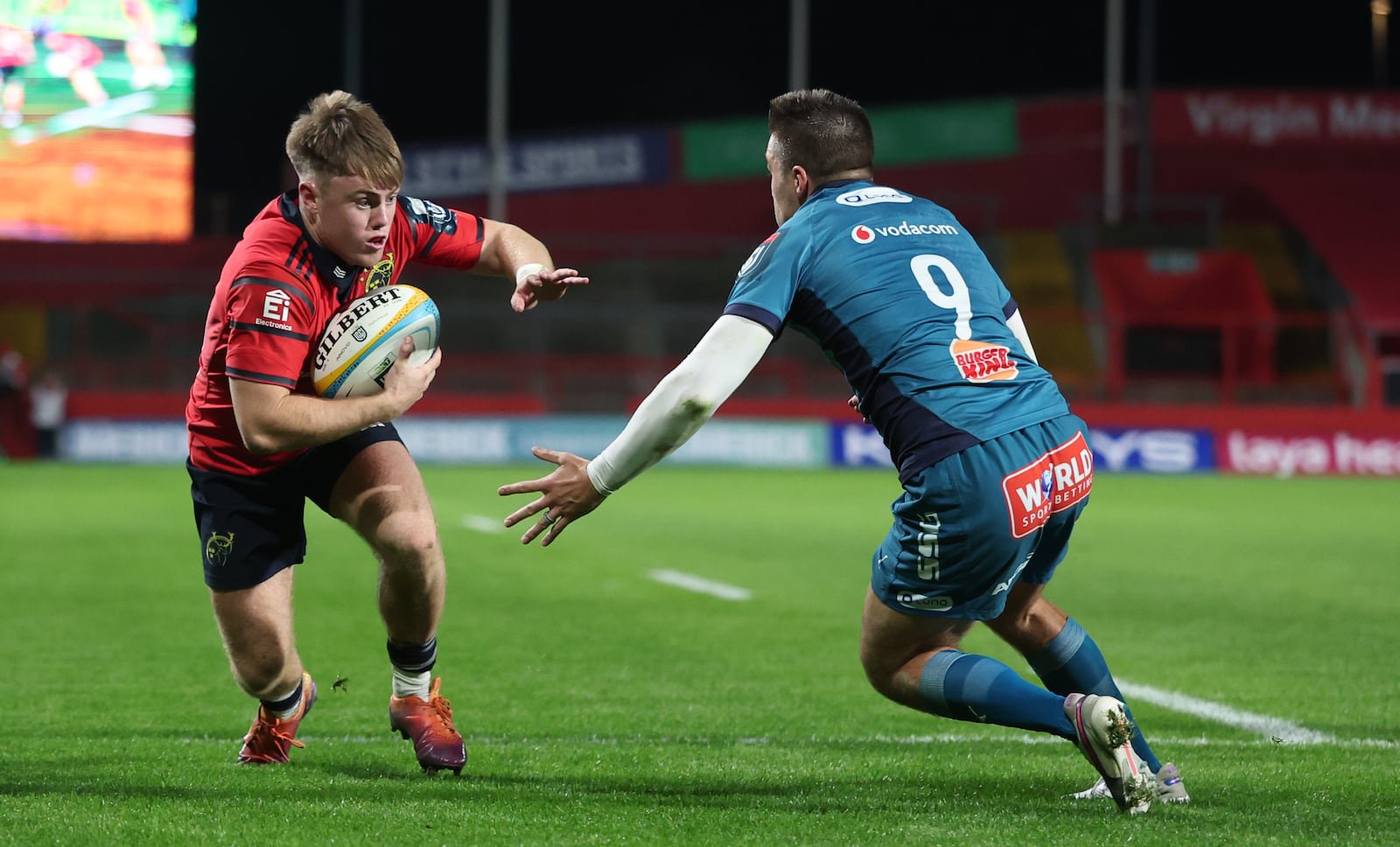Munster's Charlie O’Shea scores a try despite Zak Burger of the Bulls. Photograph: James Crombie/Inpho