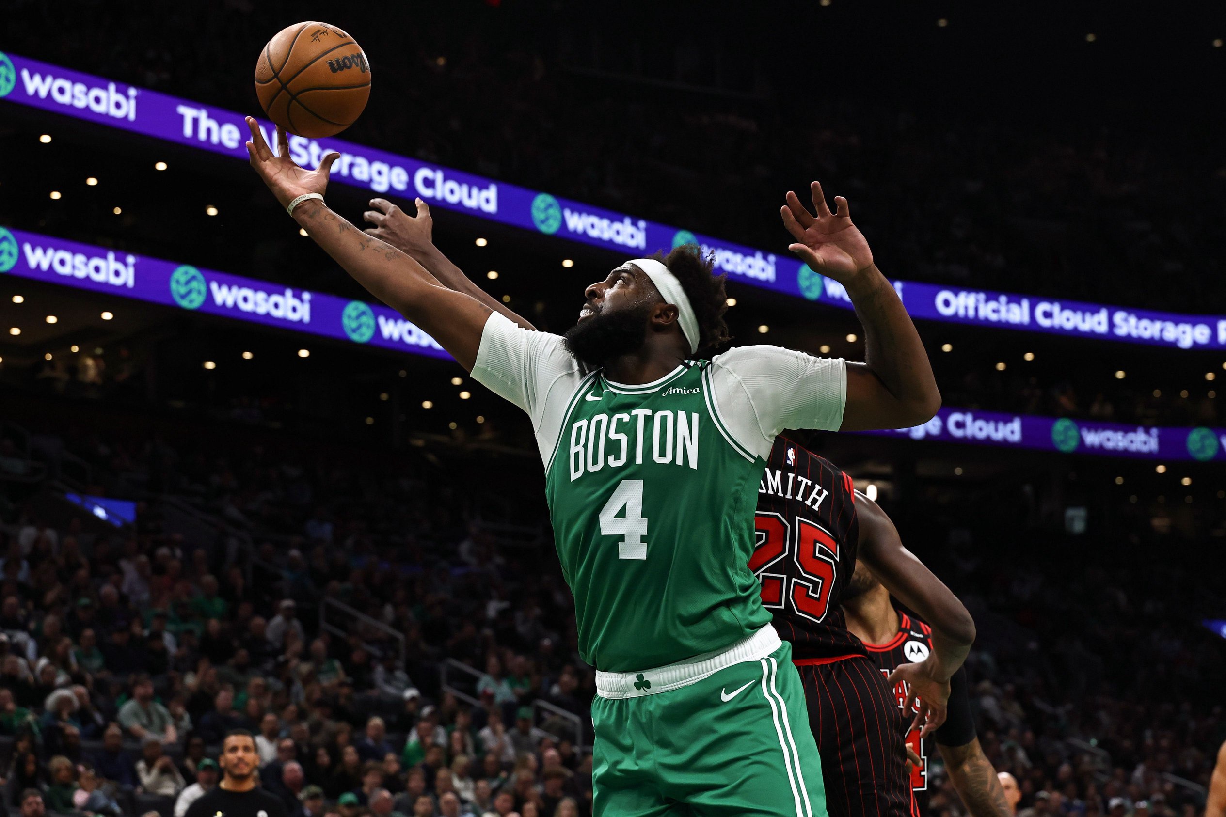 Oct 26, 2026; Boston, Massachusetts, USA; Boston Celtics center Mitchell Robinson (4) reaches for a loose ball during the second half against the Chicago Bulls at TD Garden. Mandatory Credit: Winslow Townson-Imagn Images