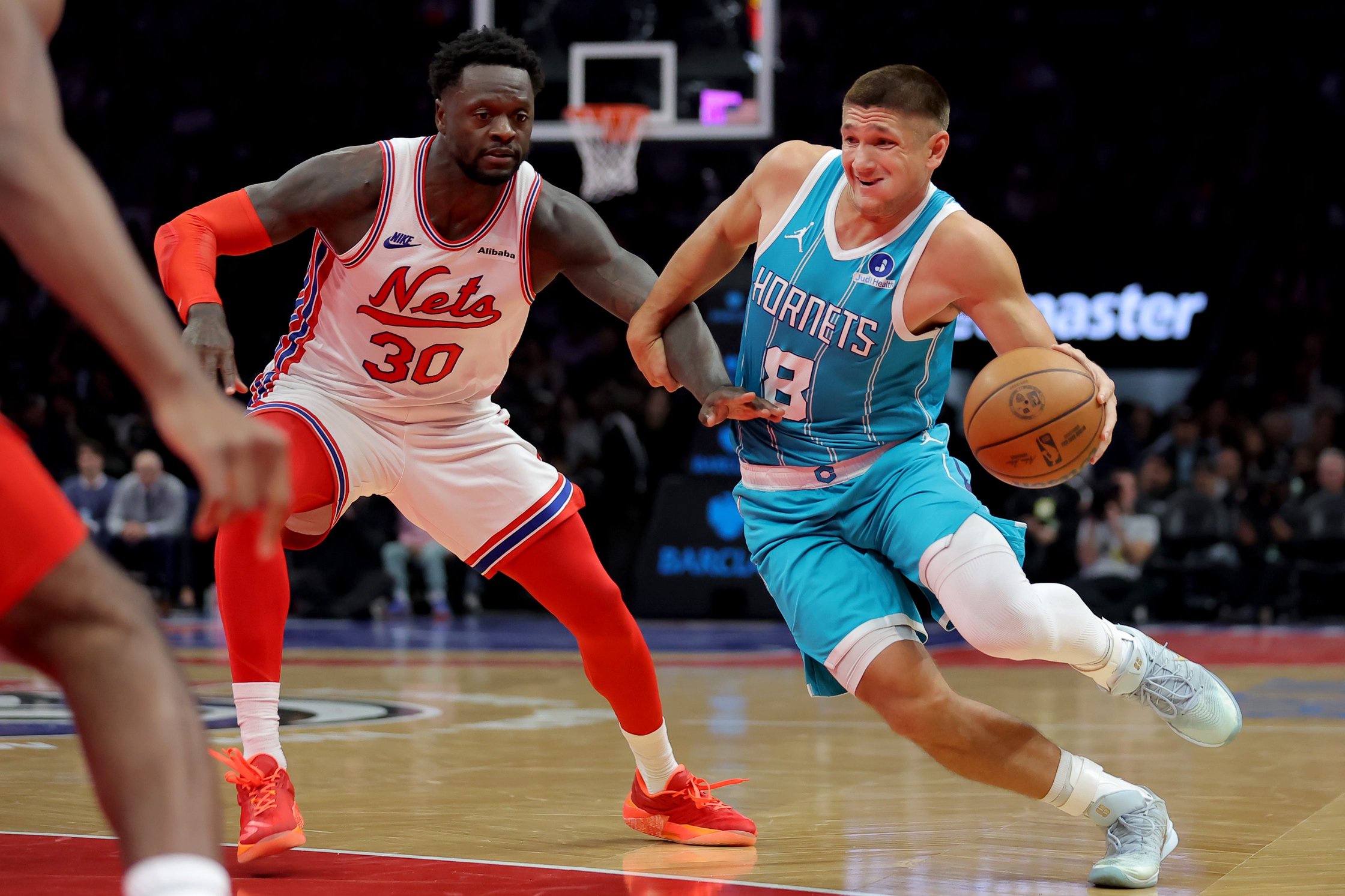 Oct 21, 2026; Brooklyn, New York, USA; Charlotte Hornets guard Grayson Allen (8) drives to the basket against Brooklyn Nets forward Julius Randle (30) during the first quarter at Barclays Center. Mandatory Credit: Brad Penner-Imagn Images