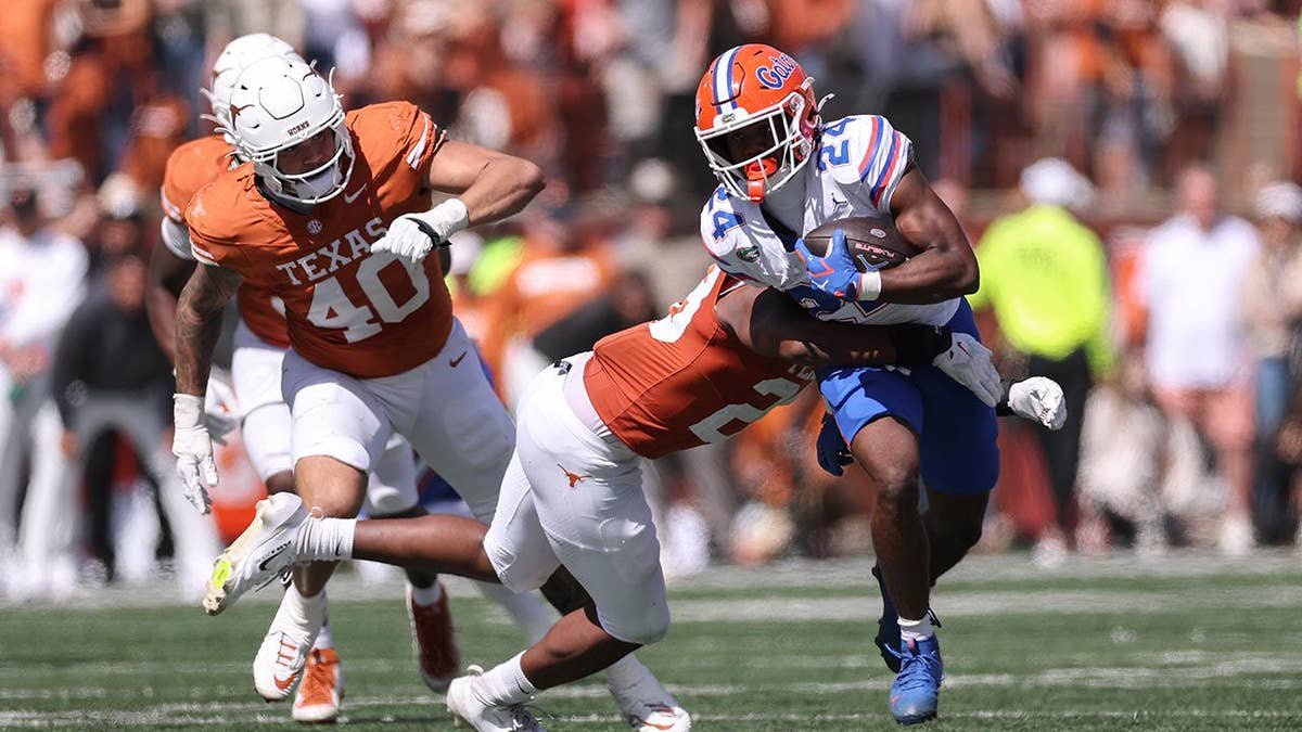 Florida football player running with the ball during a college football game