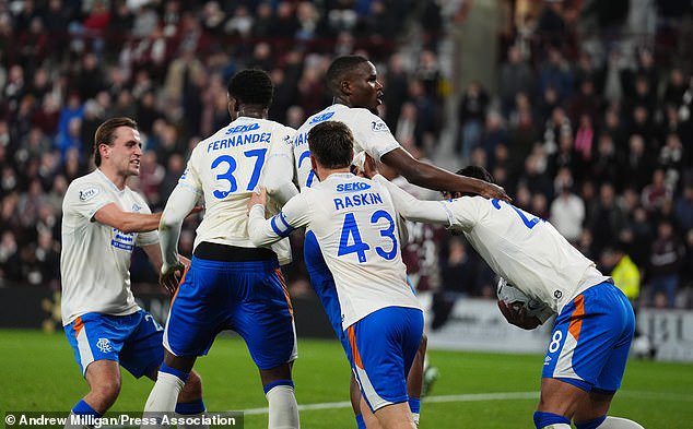 Rangers players celebrate Makhanya's late leveller as the Ibrox men claimed a valuable point