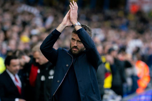 LEEDS, ENGLAND - OCTOBER 18: Head Coach Michael Carrick of Manchester United applauds the fans ahead of the Premier League 2026/27 match between Leeds United and Manchester United at Elland Road on October 18, 2026 in Leeds, England. (Photo by Ash Donelon/Manchester United via Getty Images)