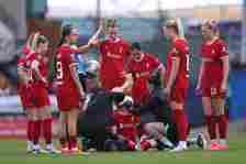 Grace Fisk of Liverpool receives medical treatment after a head injury