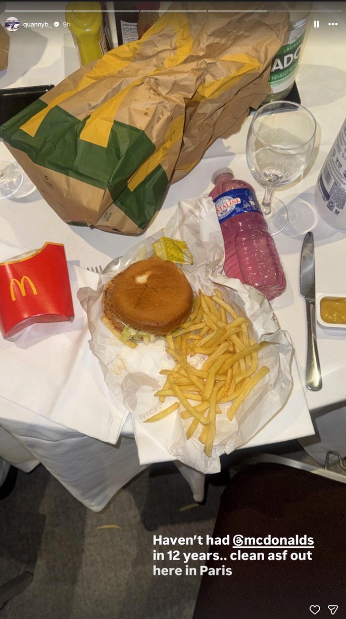 A McDonald's meal, including a burger, fries, and a drink, sits on a table in Paris.