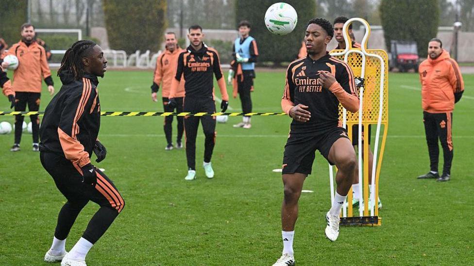 Eberechi Eze and Myles Lewis-Skelly of Arsenal during a training session 
