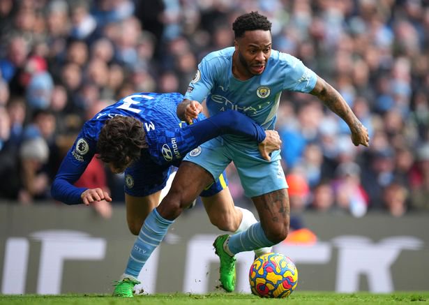 Raheem Sterling of Manchester City battles for possession with Marcos Alonso of Chelsea during the Premier League match between Manchester City and Chelsea at Etihad Stadium on January 15, 2022 in Manchester, England.