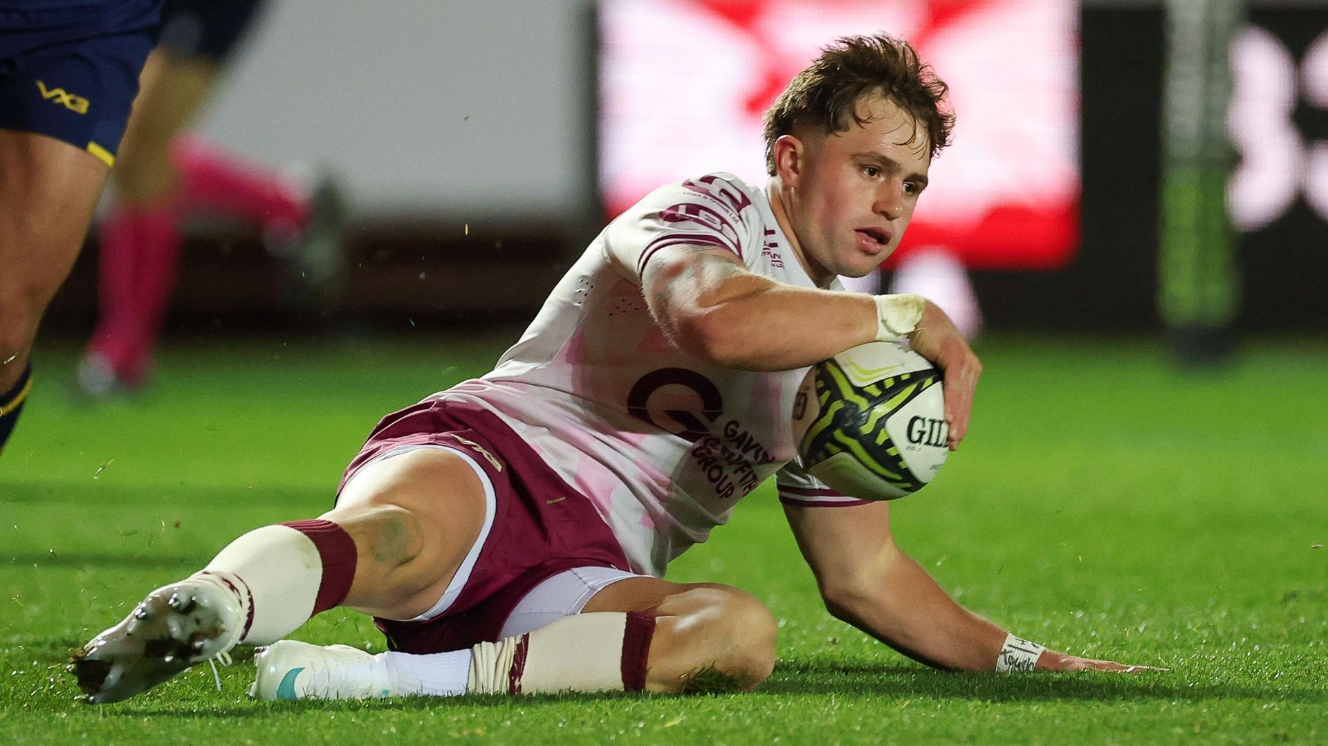 Macs Page grounds the ball to score for Scarlets
