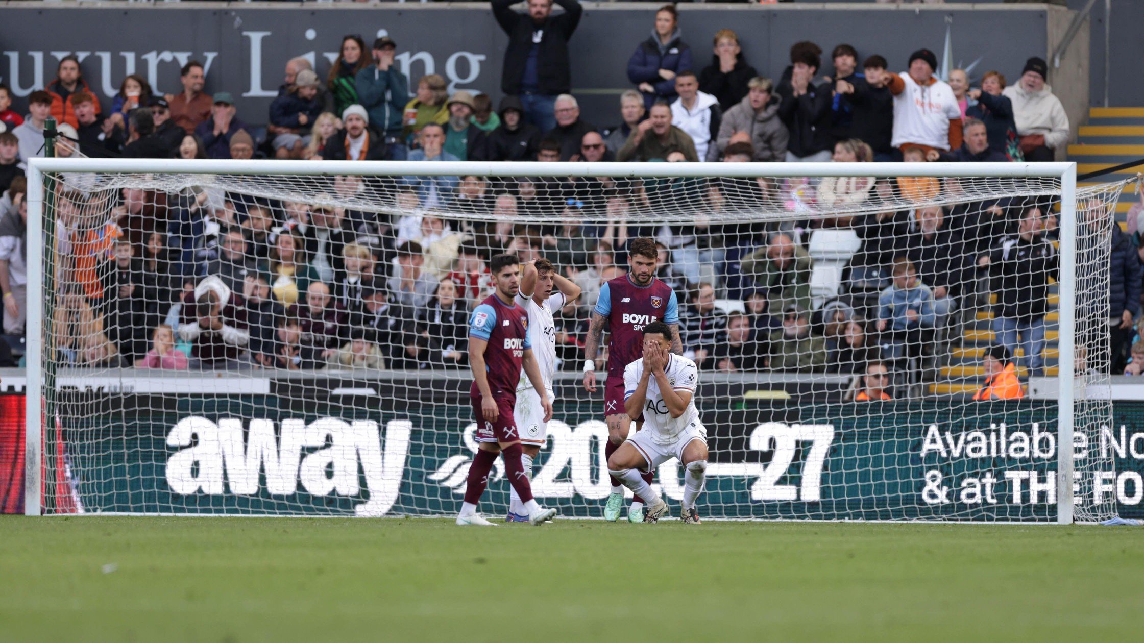 Ben Cabango holds his head after missing a chance 