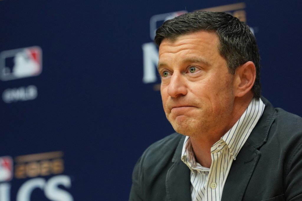Craig Counsell speaking at a press conference during the National League Championship Series.