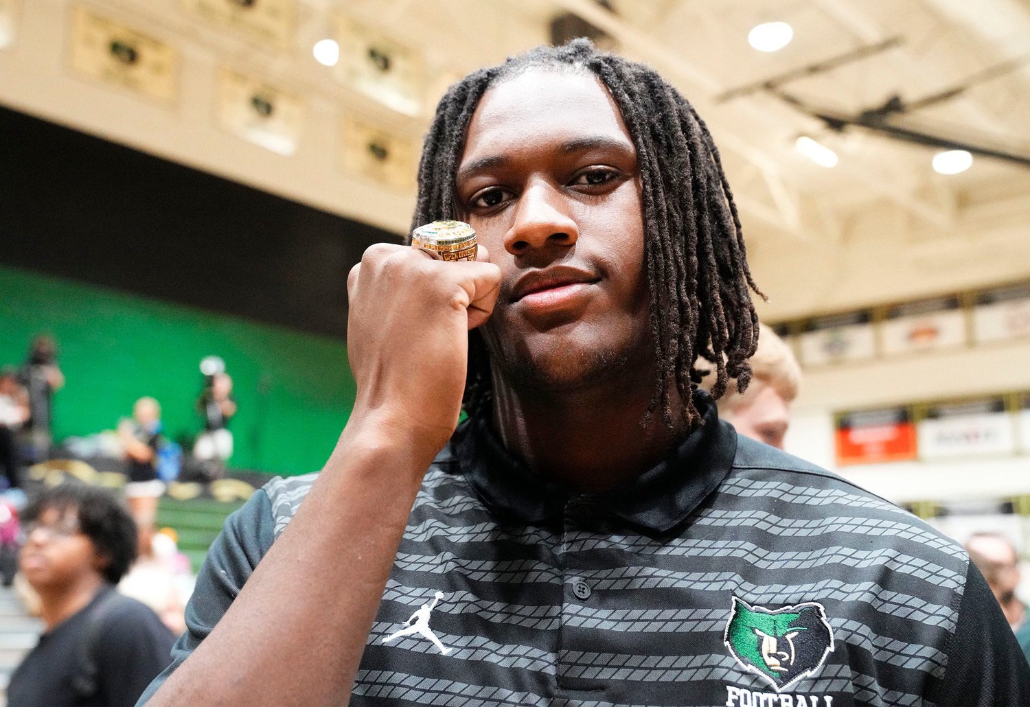 Basha High defensive lineman Landen Wade poses with his ring during the ring ceremony honoring players and coaches who were part of the 2025 Open Division state championship team on April 29, 2026, at Basha High in Chandler.