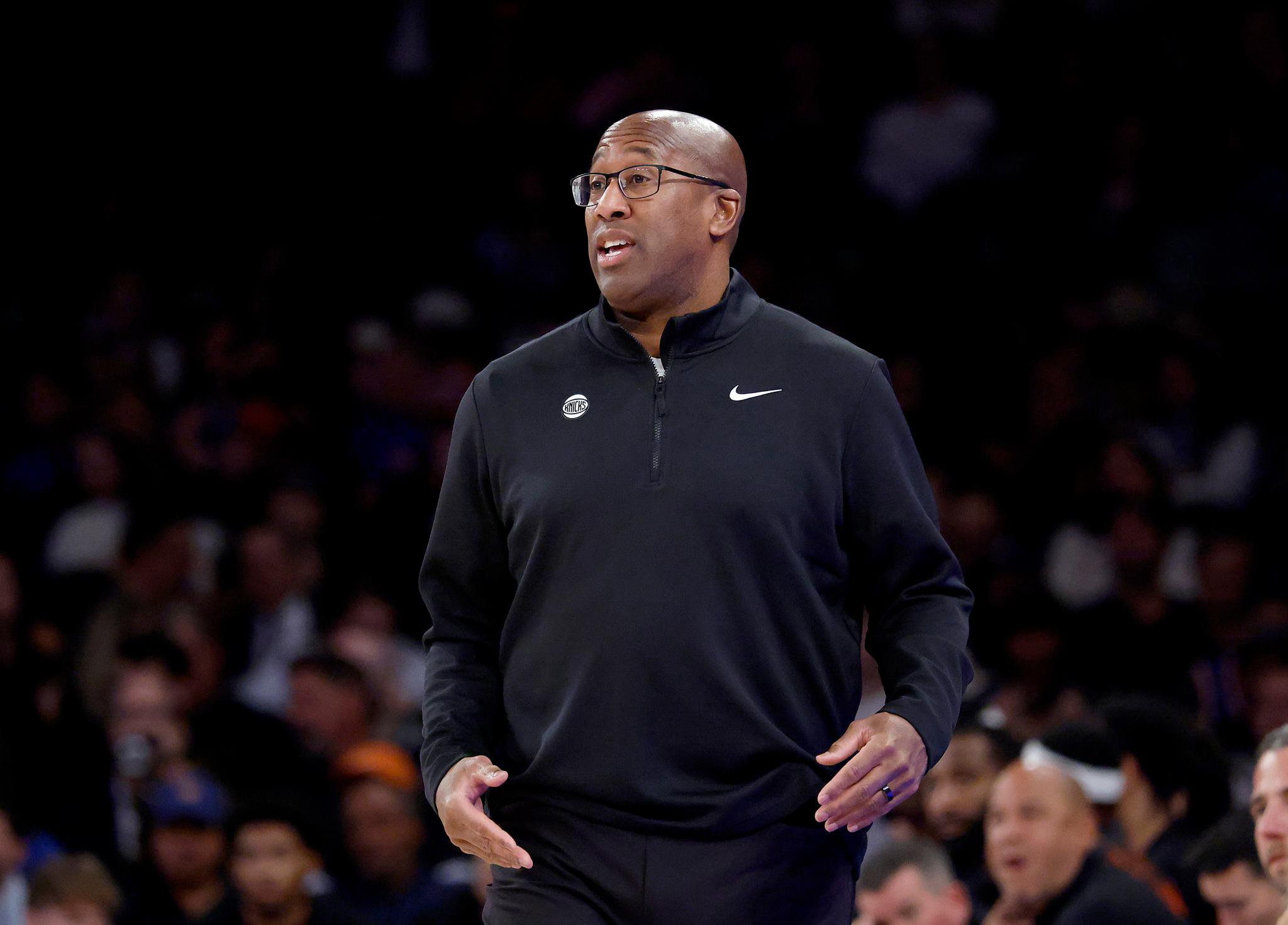 New York Knicks head coach Mike Brown on the baseline during a game.