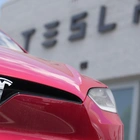 Tesla’s stock leaps on reports of Chinese approval for the company’s driving software