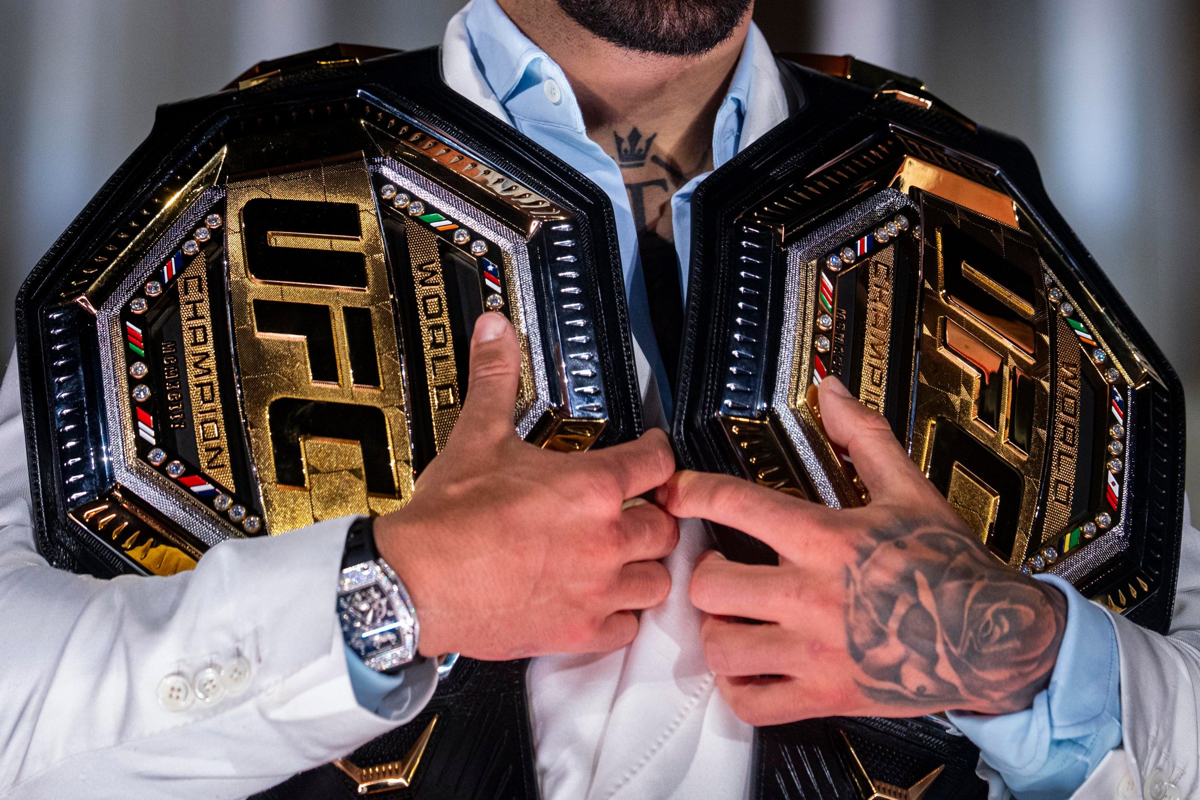 WASHINGTON, DC - JUNE 12: Ultimate Fighting Championship lightweight fighter Ilia Topuria holds his UFC belts during a press conference at the Lincoln Memorial ahead of the upcoming UFC Freedom 250 fight on the South Lawn of the White House on June 12, 2026 in Washington, DC. UFC Freedom 250 will take place this Sunday, June 14th. (Photo by Al Drago/Getty Images)