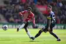 Kyle Walker-Peters of Southampton passes the ball as Sam Greenwood of Middlesbrough looks on during the Sky Bet Championship match between Southamp...