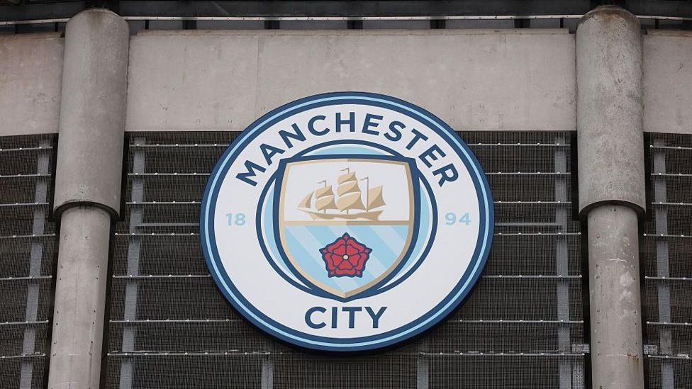 A general view outside the Etihad Stadium showing Manchester City's logo