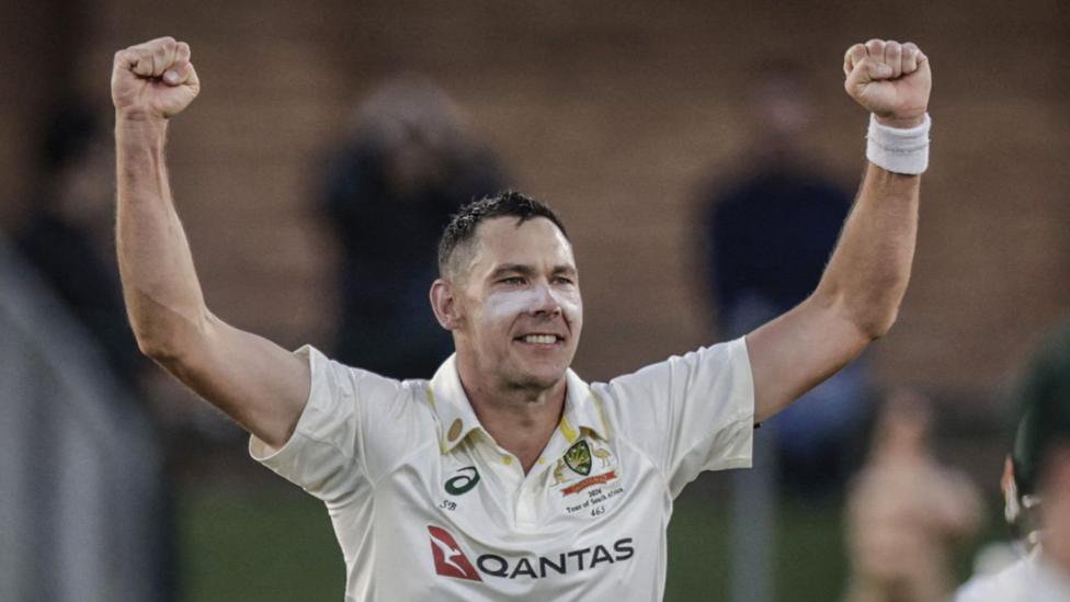 Scott Boland celebrates wicket with his arms held out