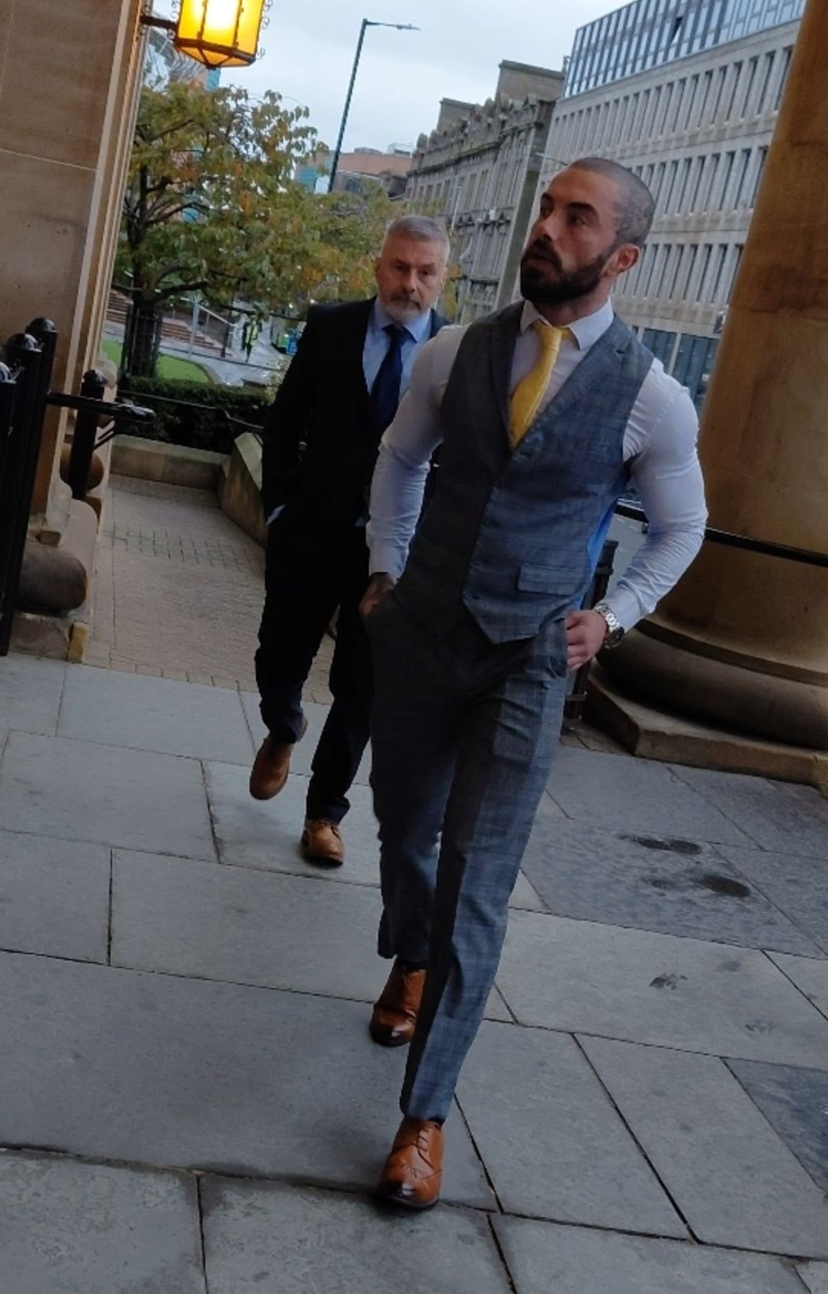 Sean, behind, and Liam, right, outside court 