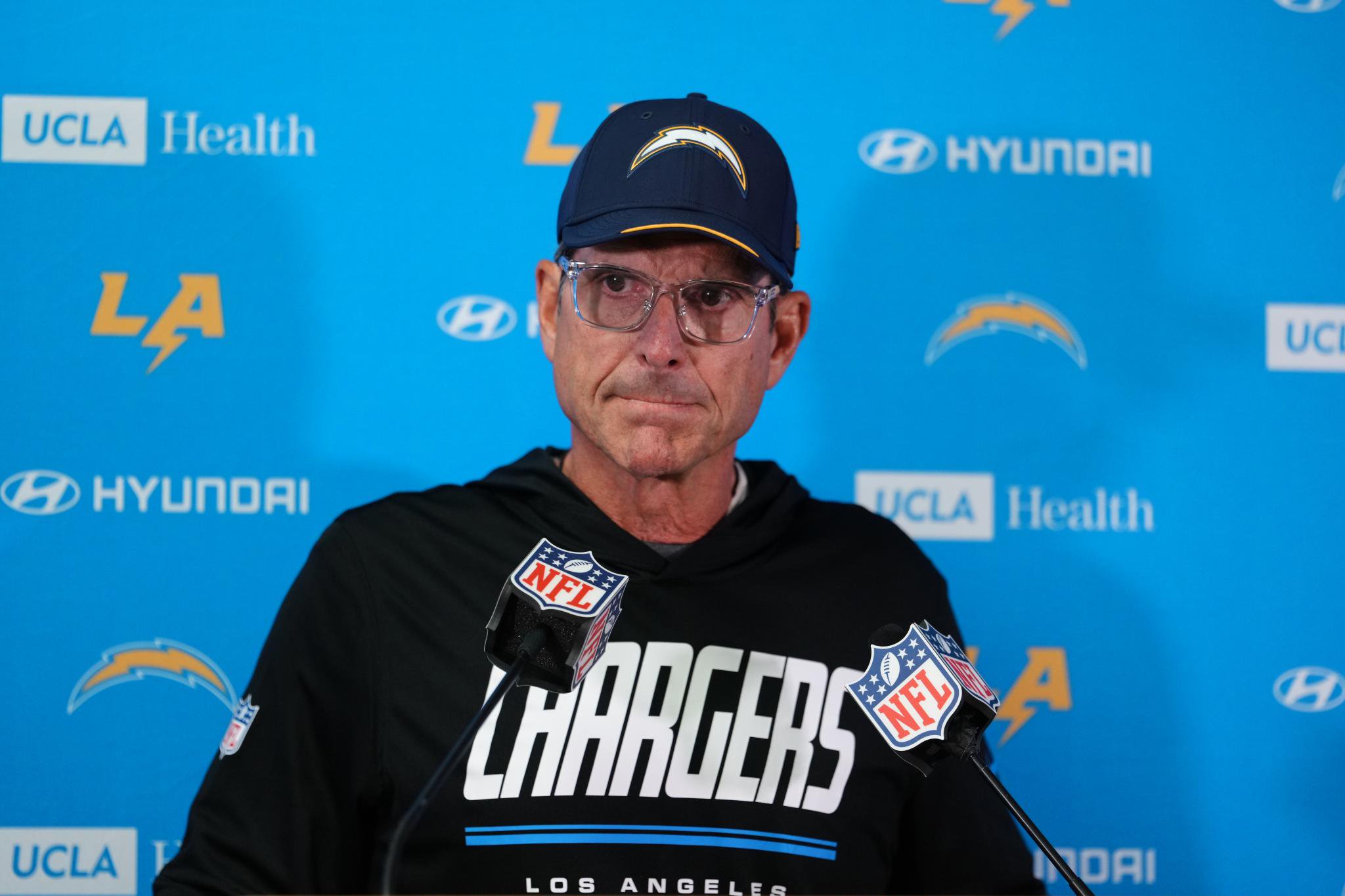 Los Angeles Chargers head coach Jim Harbaugh speaks at a news conference.