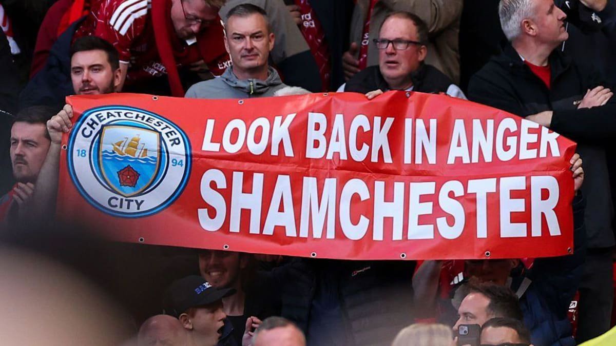  Liverpool fans display a banner reading "Look Back In Anger Shamchester"