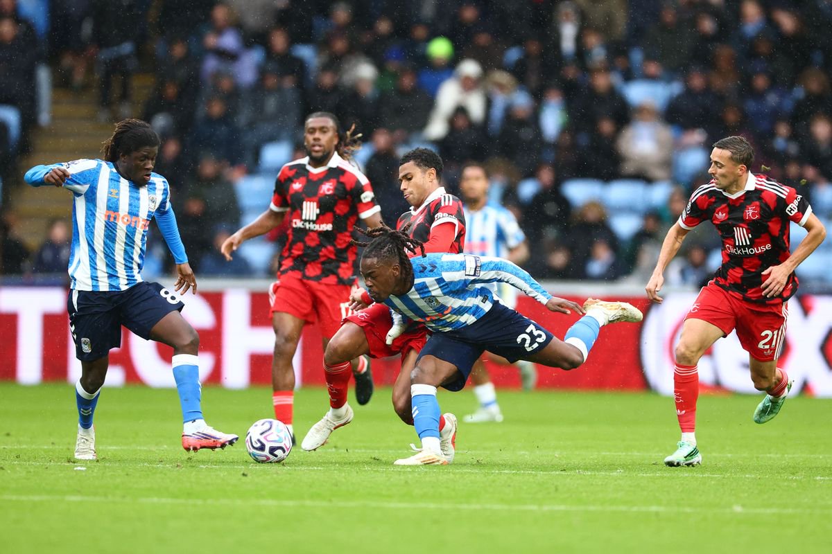 Brandon Thomas-Asante of Coventry City is fouled by Shea Charles of Fulham.