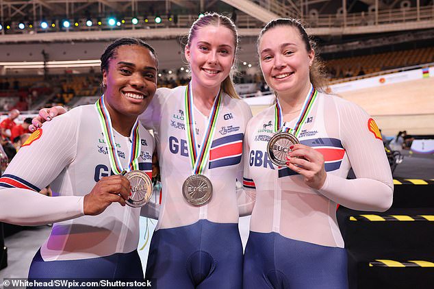 Sophie Capewell (left), Finucane (centre) and Rhianna Parris-Smith are pictured with their silver medals on Wednesday after coming second in the Women's Team Pursuit