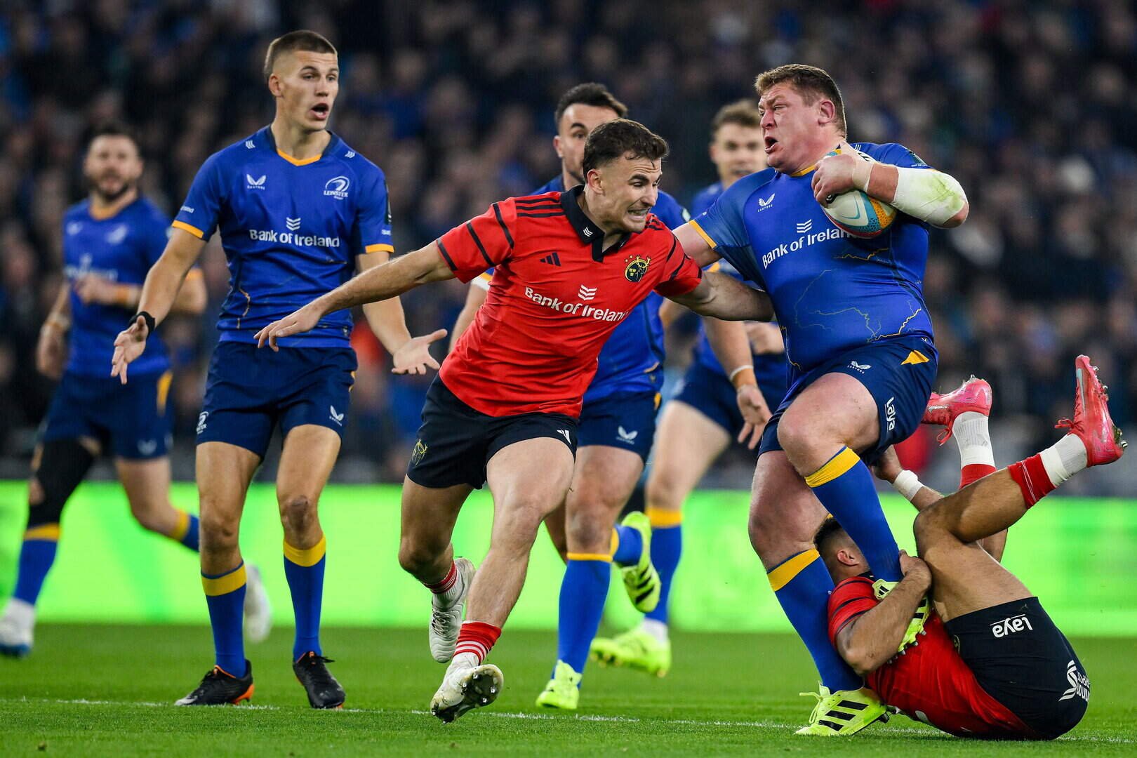 Leinster’s Tadhg Furlong is tackled by Tom Farrell, right, and Shane Daly of Munster during last year’s URC derby at Croke Park 