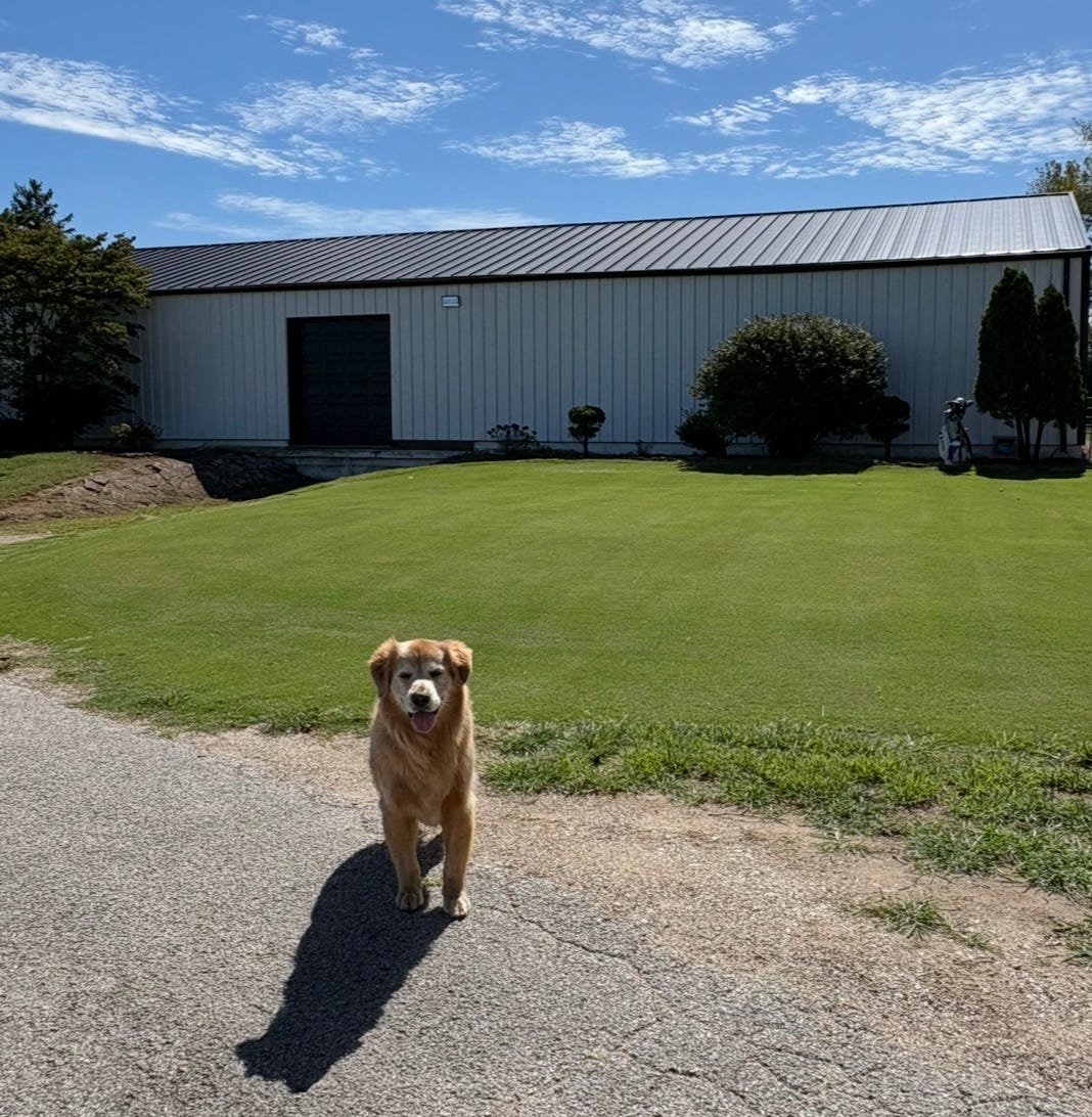 Adam Schenk's Golf Barn in Vincennes, Indiana, and his trusty companion, Bunker.