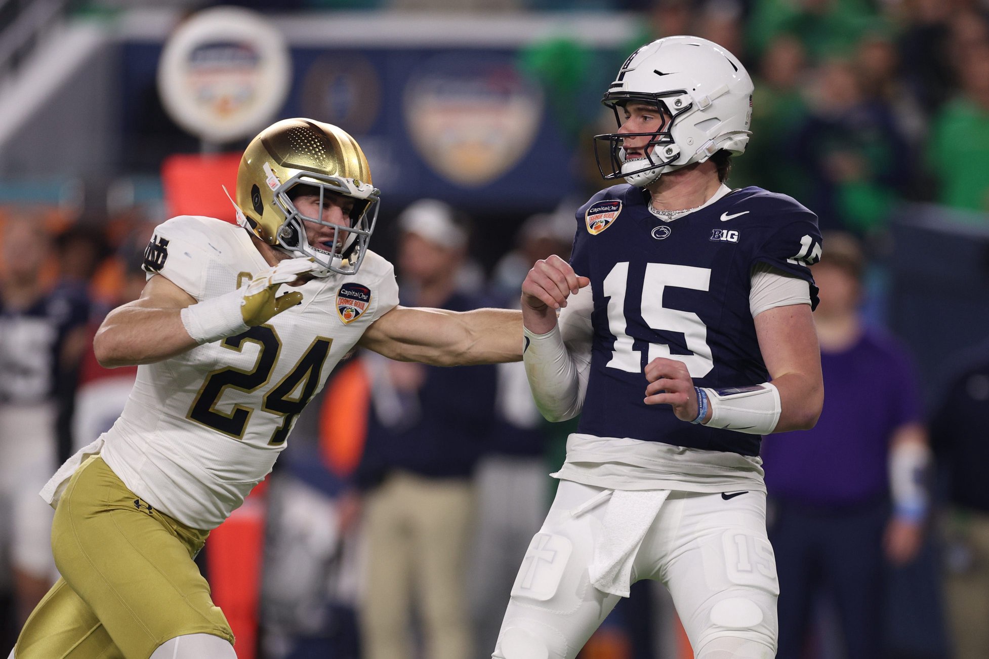 Jan 9, 2025; Miami, FL, USA; Penn State Nittany Lions quarterback Drew Allar (15) is pressured by Notre Dame Fighting Irish linebacker Jack Kiser (24) in the first half in the Orange Bowl at Hard Rock Stadium. Mandatory Credit: Nathan Ray Seebeck-Imagn Images