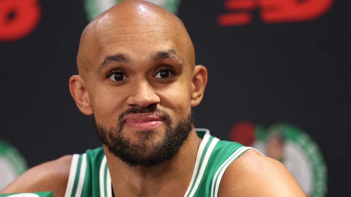 Derrick White #9 of the Boston Celtics answers questions