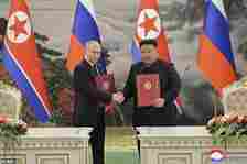 Kim Jong Un, right, and Russia's President Vladimir Putin shake hands after signing a comprehensive strategic partnership in Pyongyang, North Korea Wednesday, June 19, 2024