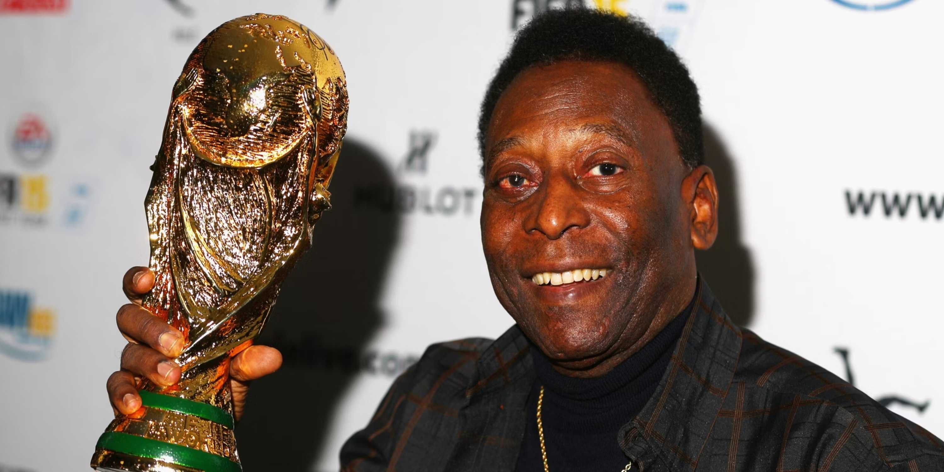 Pele lifting the World Cup trophy.