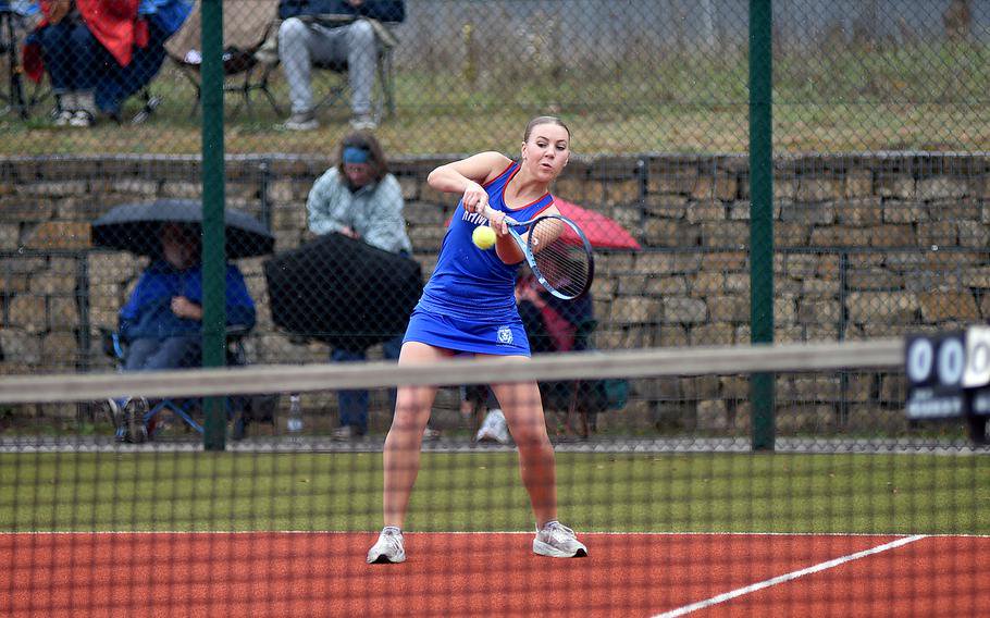 Rebeka Francis grimaces while she connects with the ball.