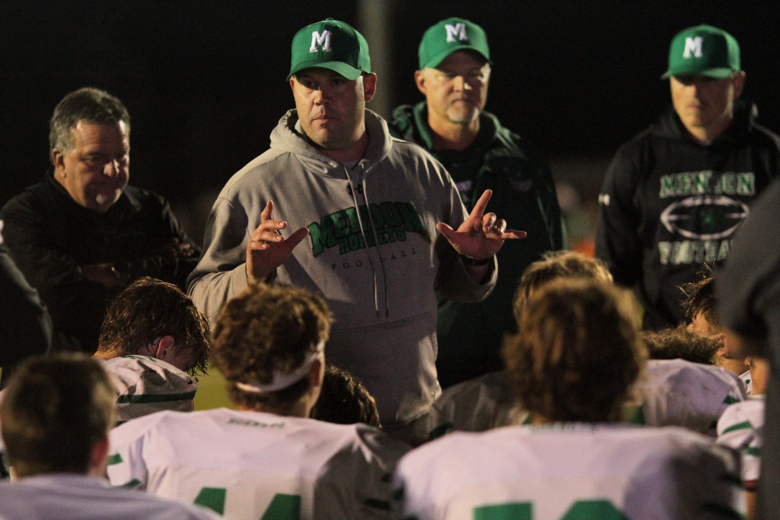Mendon coach Bobby Kretschman chats with his team following Friday night's win over Colon.