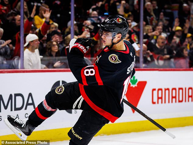 Ottawa Senators' Tim Stutzle (18) celebrates his goal against the Nashville Predators during second period of an NHL hockey game in Ottawa, Ontario, Saturday, Oct. 10, 2026. (Keito Newman/The Canadian Press via AP)