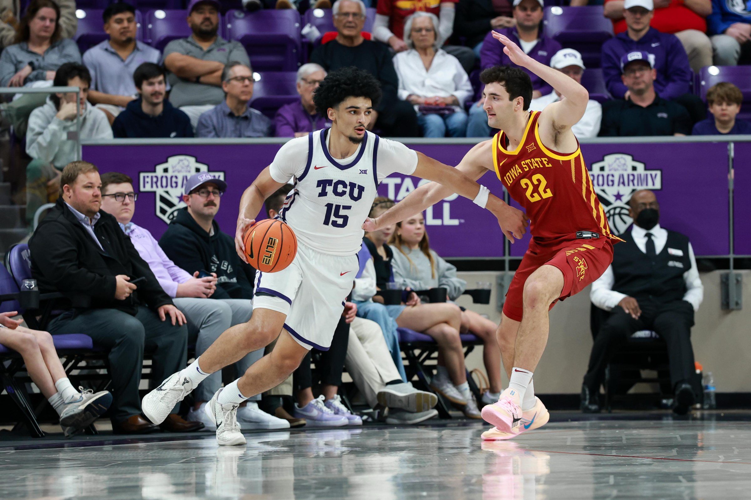 FORT WORTH, TX - FEBRUARY 10: TCU Horned Frogs forward David Punch (#15) dribbles the ball as Iowa State Cyclones forward Milan Momcilovic (#22) defends during the Big 12 college basketball game between the TCU Horned Frogs and Iowa State Cyclones on February 10, 2026 at Ed & Rae Schollmaier Arena in Fort Worth, Texas. (Photo by Matthew Visinsky/Icon Sportswire via Getty Images)
