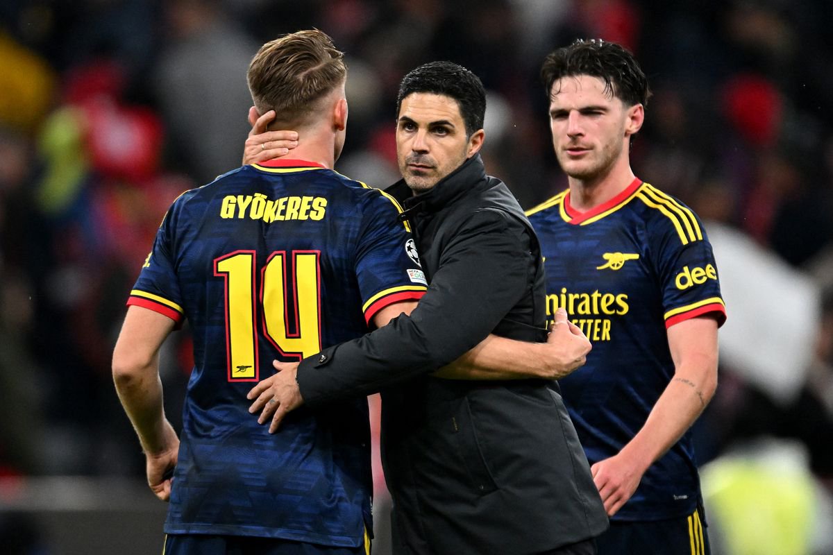Mikel Arteta, Manager of Arsenal, celebrates with Viktor Gyokeres and Declan Rice of Arsenal after the UEFA Champions League 2026/27 League Phase MD3 match between FC Bayern München and Arsenal FC at Football Arena Munich on October 21, 2026 in Munich, Germany