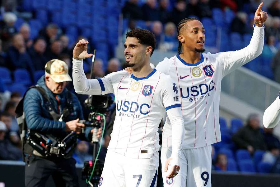 Chelsea's Pedro Neto celebrates scoring their first goal with Joao Pedro 