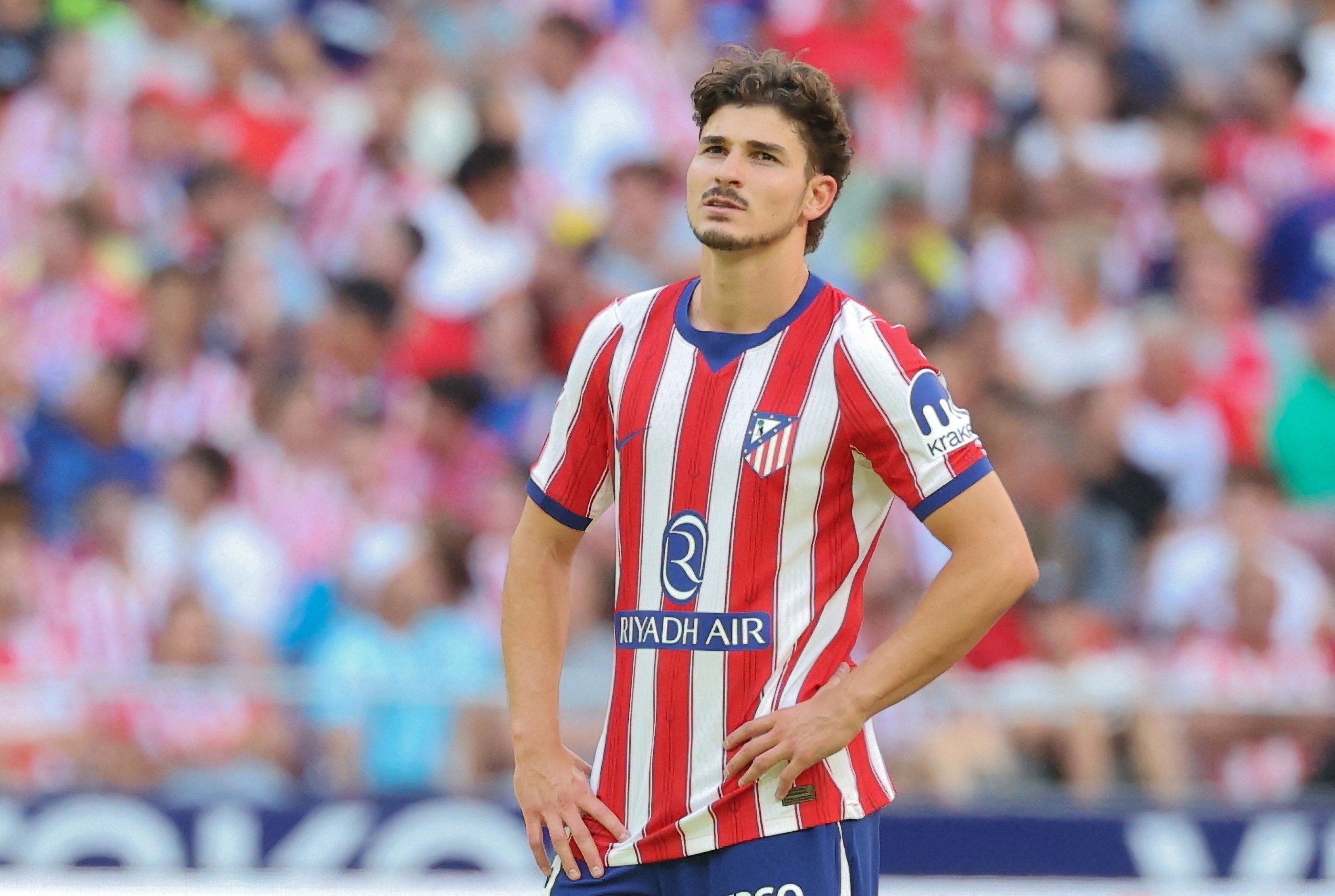 Julian Alvarez looks on while playing for Atletico Madrid.