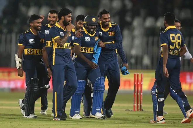 Sri Lanka celebrate their famous victory.