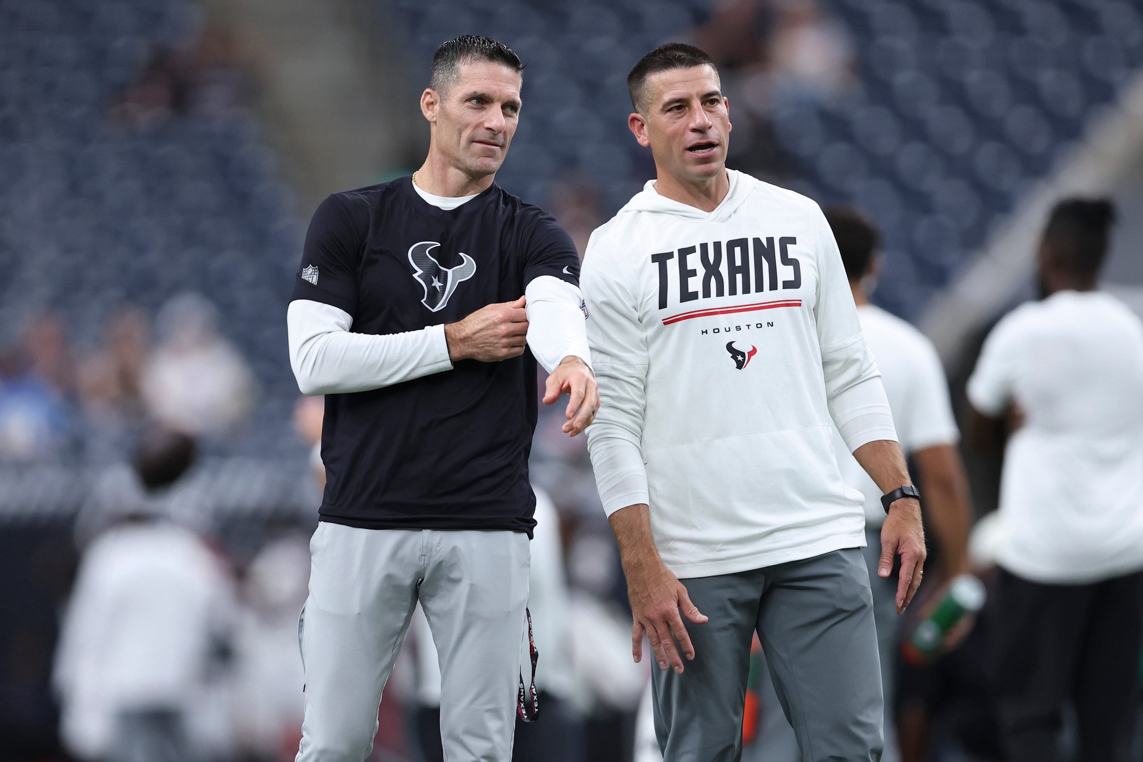 Aug 13, 2026; Houston, Texas, USA;  Houston Texans general manager Nick Caserio (left) talks with special teams coordinator Frank Ross before the game against the Los Angeles Chargers at Reliant Stadium. Mandatory Credit: Troy Taormina-Imagn Images