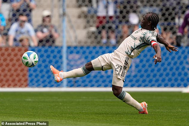 FILE - Portland Timbers midfielder Diego Chará kicks the ball during the first half of an MLS soccer match against Sporting Kansas City, April 13, 2025, in Kansas City, Kan. (AP Photo/Charlie Riedel, File)