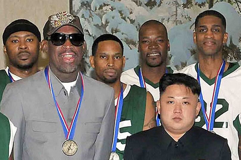 North Korean leader Kim Jong-Un (front R) photographed with former US basketball star Dennis Rodman (front L) and other former NBA players at Pyongyang Gymnasium in Pyongyang