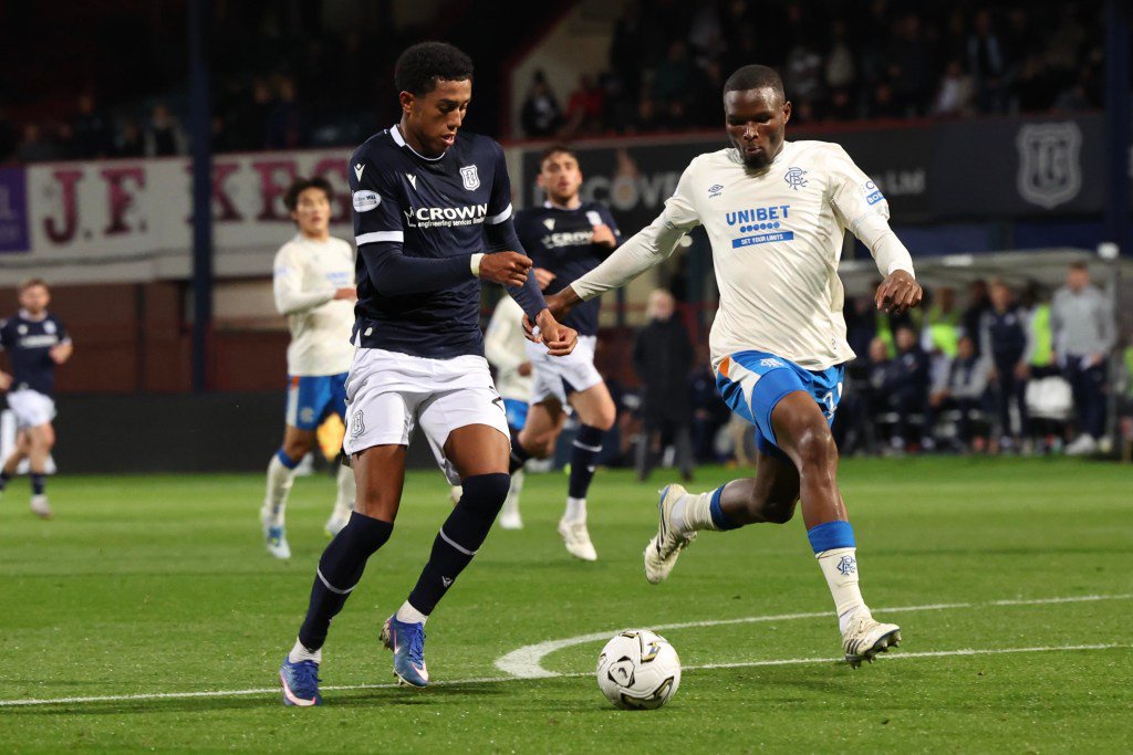 Joe Bevan of Dundee battles for the ball with Olwethu Makhanya of Rangers during a Scottish Premiership match at Dens Park.