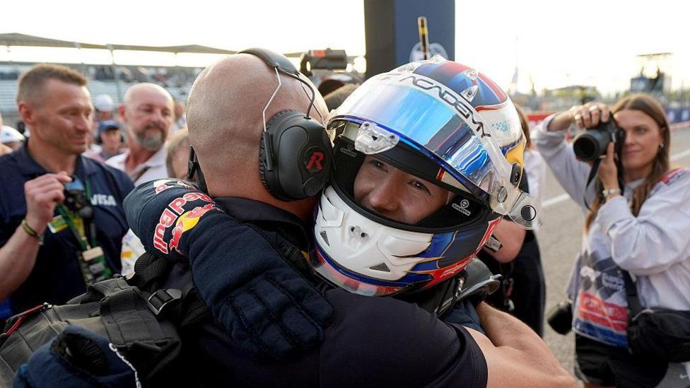 Alisha Palmowski celebrating in parc ferme with her race engineer after winning the F1 Academy title