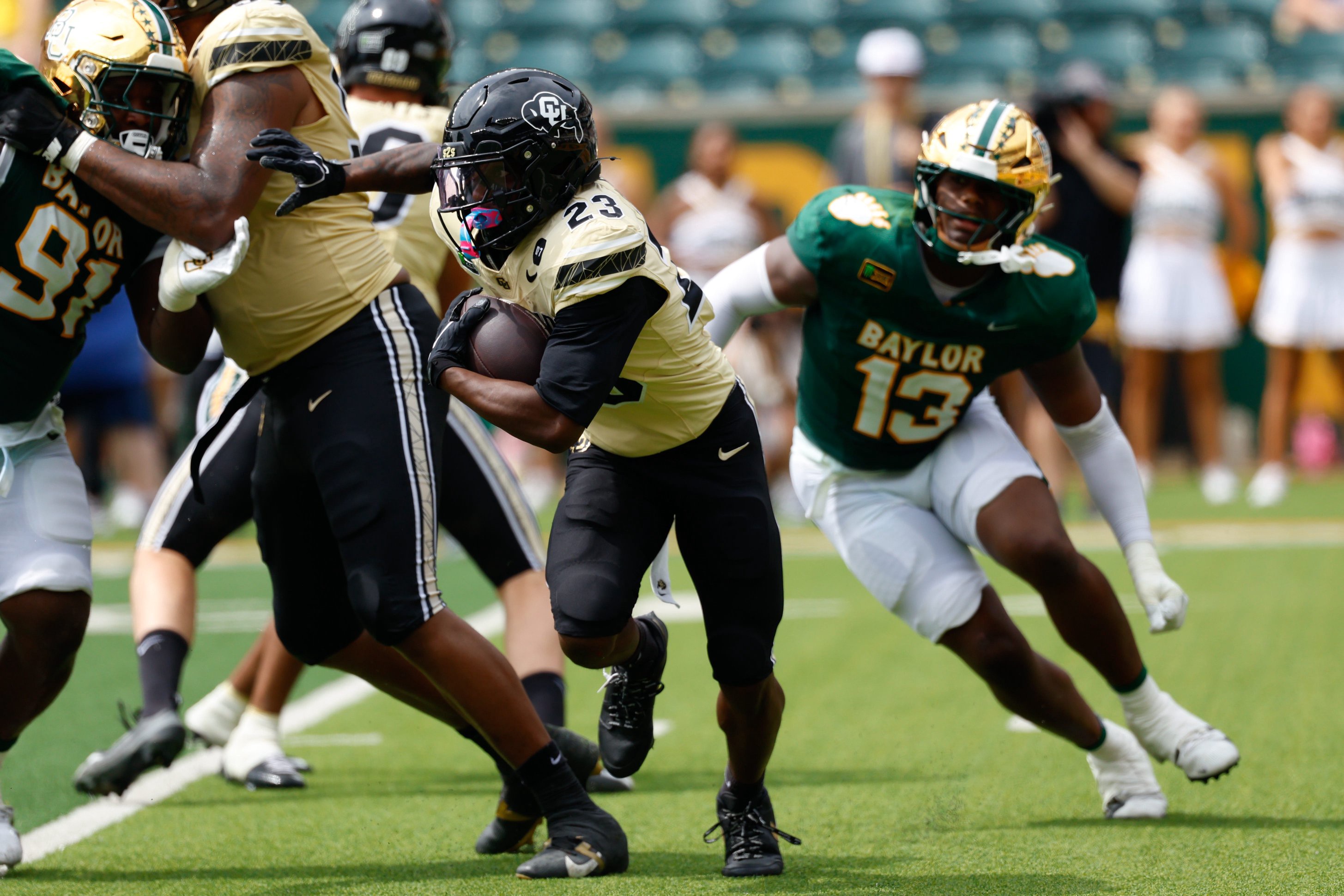 Sep 26, 2026; Waco, Texas, USA;  Colorado Buffaloes running back JaQuail Smith (23) carries the ball ahead of Baylor Bears linebacker Garrick Ponder (13) during the second half at McLane Stadium.  Mandatory Credit: Chris Jones-Imagn Images