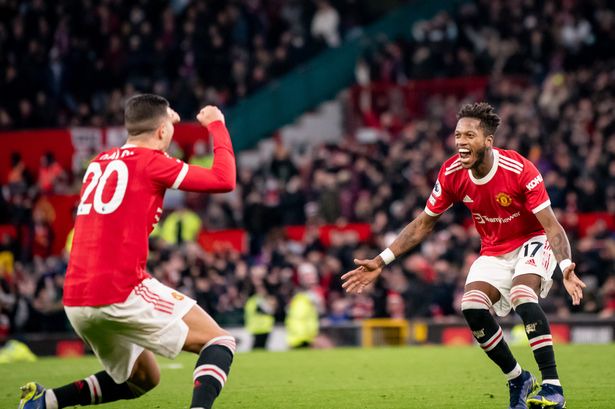 Diogo Dalot celebrates with Fred after his goal for <a class=